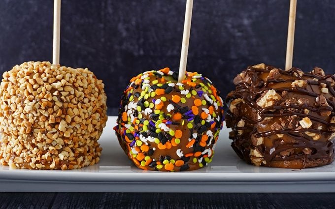 homemade caramel apples decorate with various toppings