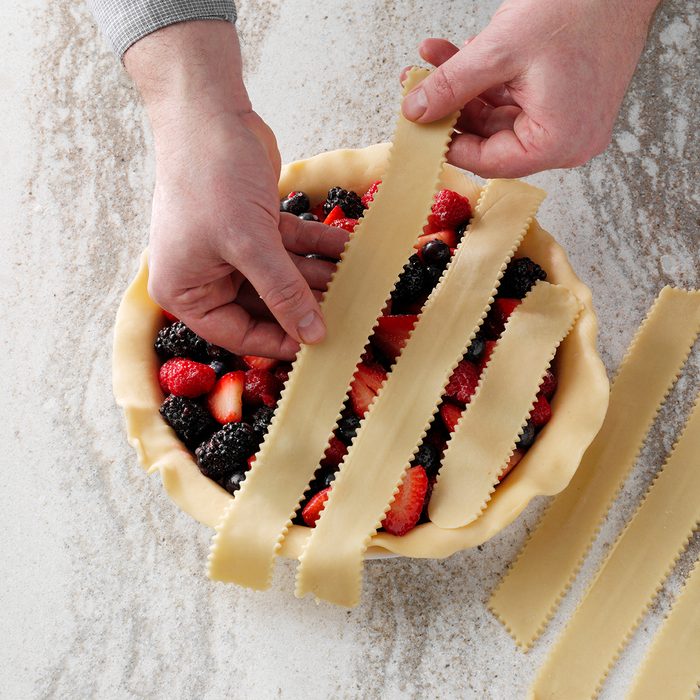 Placing first set of lattice strips on pie