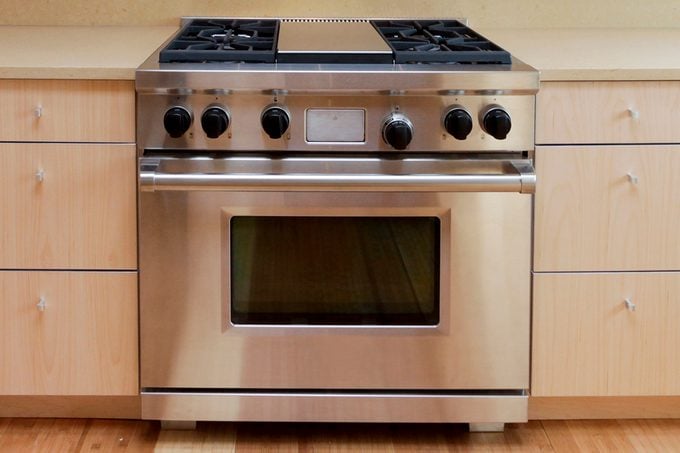 Stove And Hood In Modern Kitchen