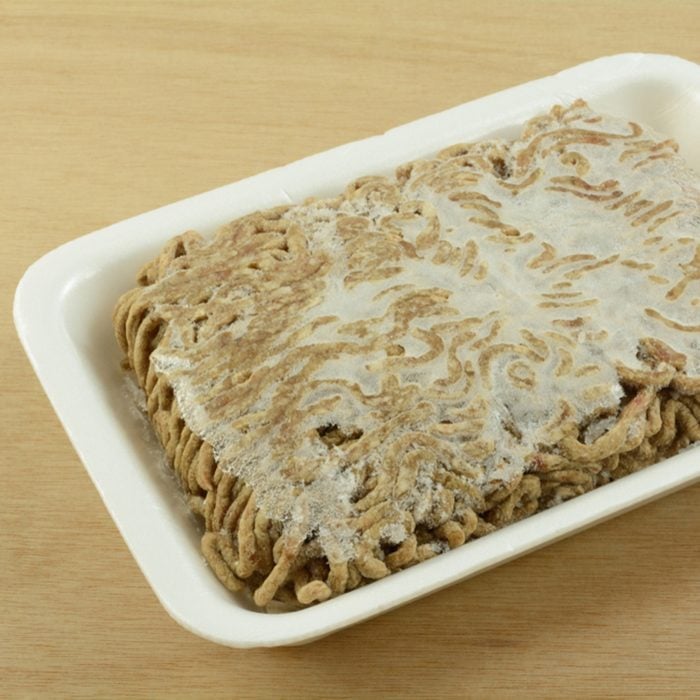 Close up of freezer burned ground beef chuck hamburger meat with frozen ice crystals due to improper storage or packaging before freezing; Shutterstock ID 1101781991; Job (TFH, TOH, RD, BNB, CWM, CM): TOH