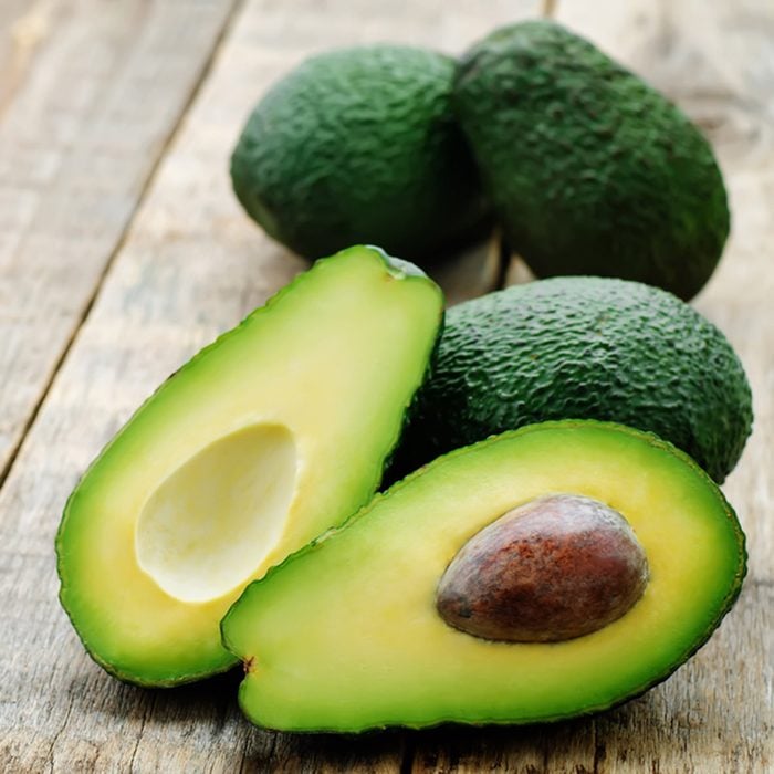 avocado on a dark wood background. tinting. selective focus; Shutterstock ID 263066309; Job (TFH, TOH, RD, BNB, CWM, CM): Taste of Home