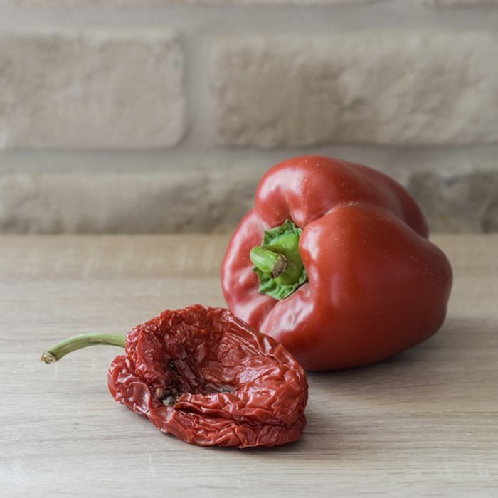 Wilted or fresh sweet pepper on a wooden table. Unhealthy or healthy food; Shutterstock ID 369647651; Job (TFH, TOH, RD, BNB, CWM, CM): TOH