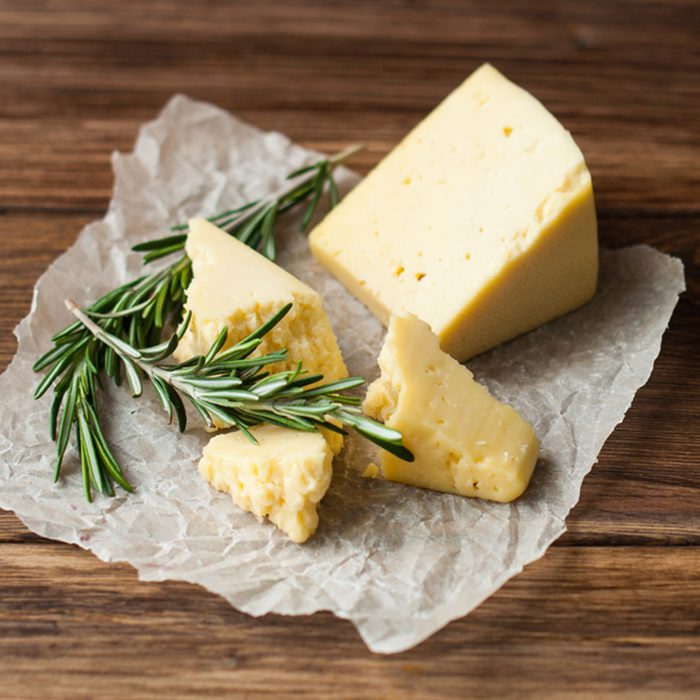 Hard cheese on a wooden table. Dairy products and agriculture.; Shutterstock ID 588101330; Job (TFH, TOH, RD, BNB, CWM, CM): Taste of Home