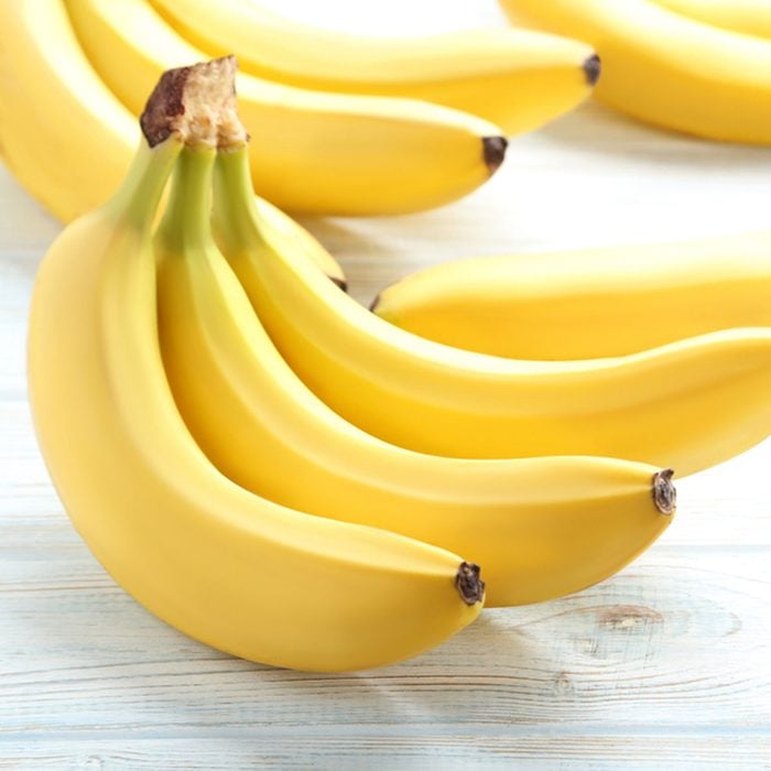 Sweet bananas on white wooden table; Shutterstock ID 626207750; Job (TFH, TOH, RD, BNB, CWM, CM): Taste of Home