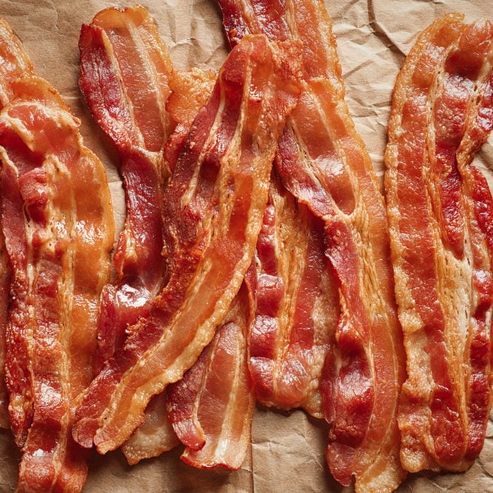 Cooked bacon rashers on parchment; Shutterstock ID 758704648