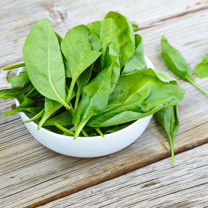 Baby spinach in a white bowl on a wooden board. Healthy food. Detox. Summer time; Shutterstock ID 793075156; Job (TFH, TOH, RD, BNB, CWM, CM): Taste of Home