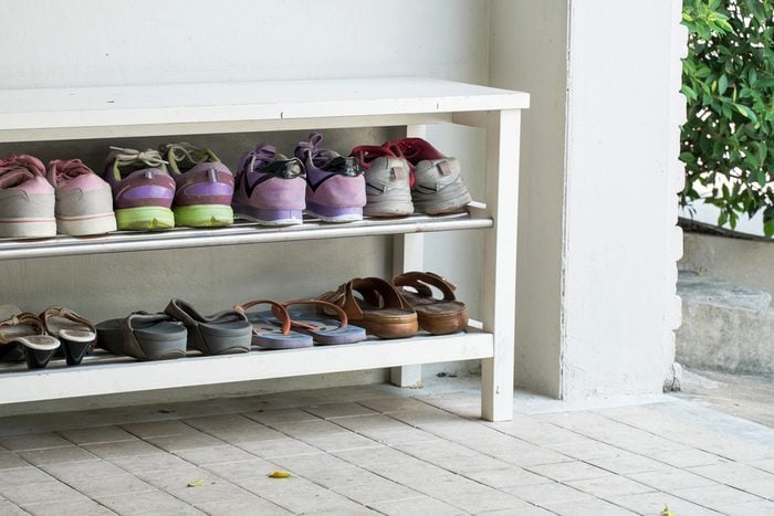Outdoor Shoe Rack and 8 pairs of visitor shoes; Shutterstock ID 397579045; Job (TFH, TOH, RD, BNB, CWM, CM): TOH Shoe Ban
