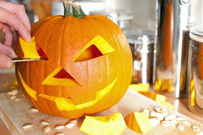 Halloween pumpkin Jack O'Lantern being carved for Halloween