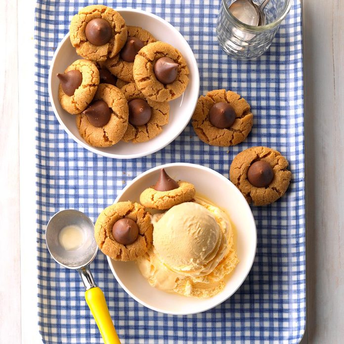 Bowl of peanutbutter kiss cookies with another bowl of ice cream
