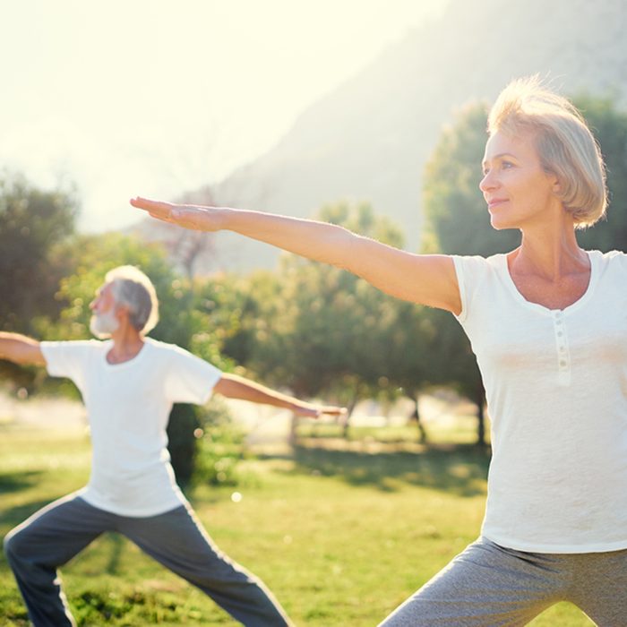 Yoga at park. Senior family couple exercising outdoors. Concept of healthy lifestyle.; Shutterstock ID 581710294; Job (TFH, TOH, RD, BNB, CWM, CM): TOH