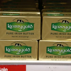 A supply of Kerrygold Pure Irish Butter sits amidst other butters on a store shelf