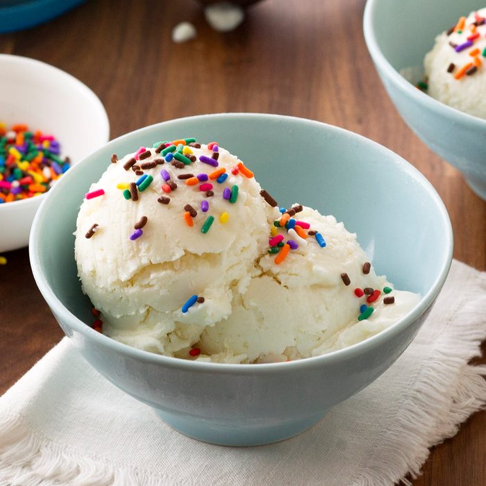 Frozen vanilla yogurt in a dish and topped with colorful sprinkles