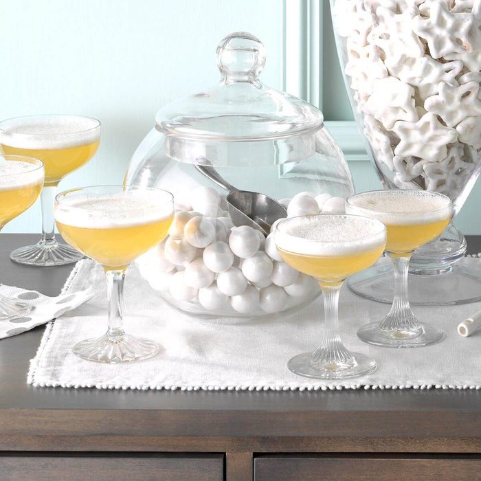 Champagne glasses with Jellied Champagne Dessert on a side table.