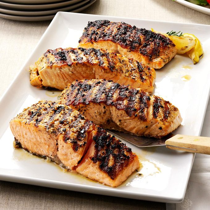 Grilled salmon on a plate with lemon.