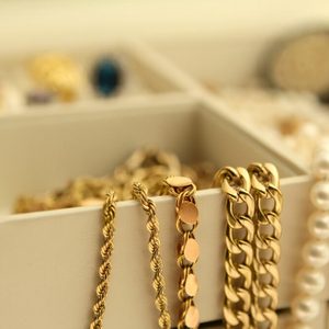 Gold jewelry and pearls in a box Copy Space