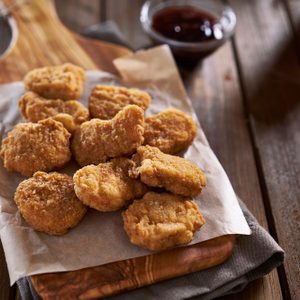 pile of crispy homemade baked chicken nuggets cooling