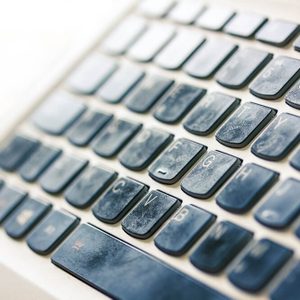 Greasy fingerprints on a computer keyboard close up