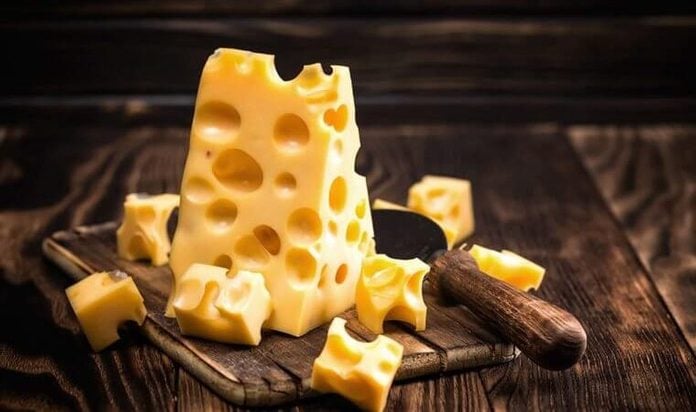 Swiss cheese on a cutting board