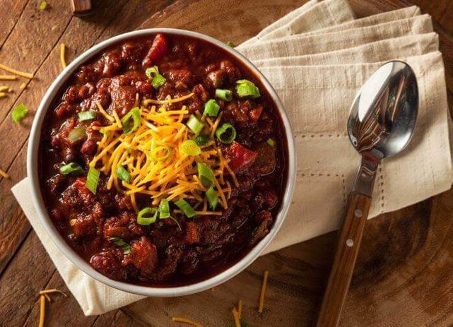 Bowl of chili with cheese on top