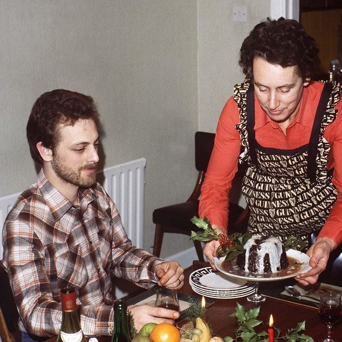 family Christmas dinner table pudding with custard