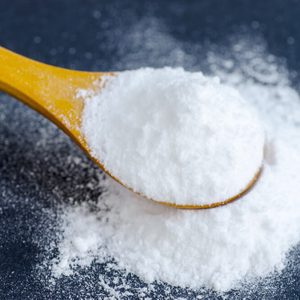 Sodium bicarbonate in a wooden spoon
