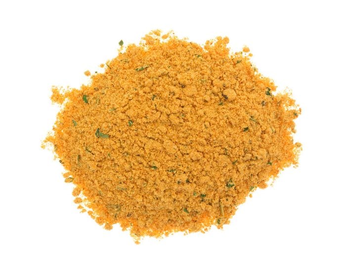 A portion of dry mesquite marinade ingredients isolated on a white background.