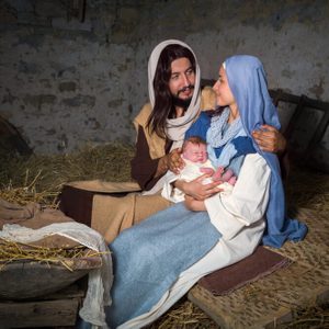 Live Christmas nativity scene in an old barn - Reenactment play with authentic costumes.