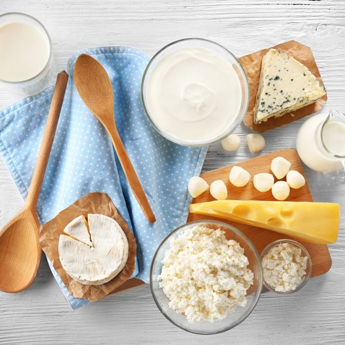 Different types of dairy products on wooden background; Shutterstock ID 573447319; Job (TFH, TOH, RD, BNB, CWM, CM): TOH