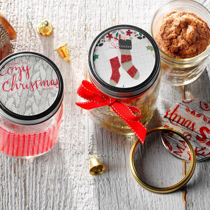 Mason jars with red ribbons and festive toppers