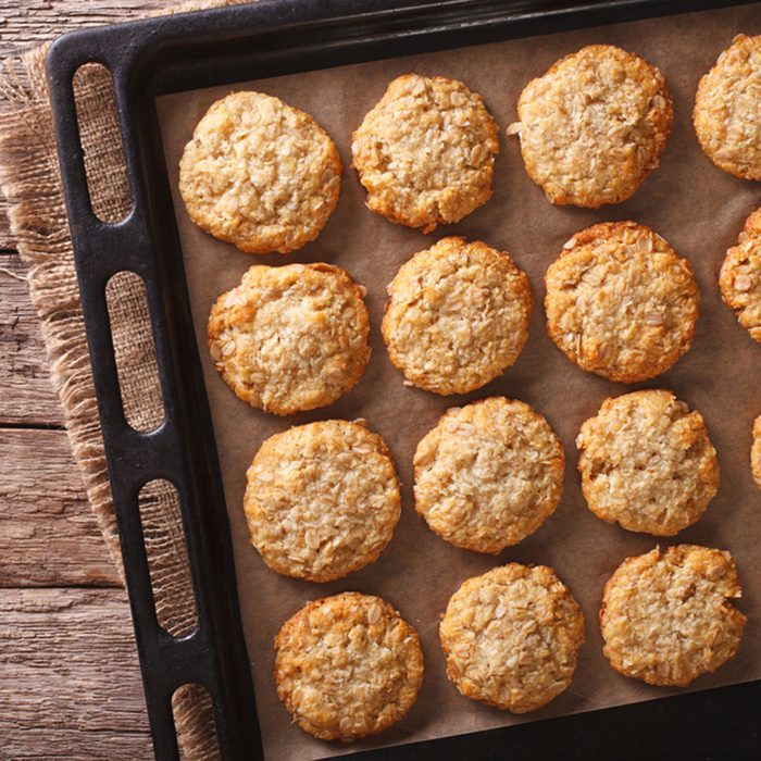 Australian oatmeal cookies close-up on a baking sheet on the table.