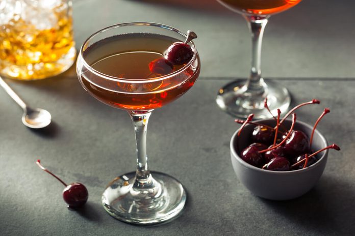 Homemade Rye Bourbon Manhattan with a Cherry Garnish