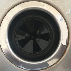 Waste disposal plug hole in a kitchen sink