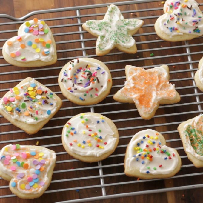 Wire rack filled with frosted sugar cookies