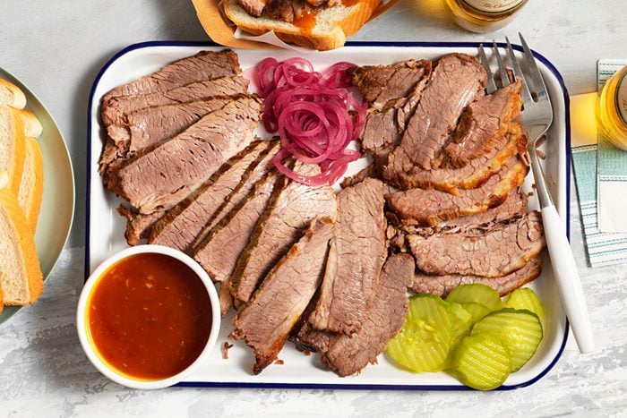 Barbecue Brisket served with pickles and sauce