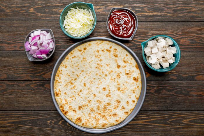 All Ingredients for Barbecue Chicken Pizza on Wooden Surface