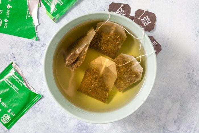 Tea Bags in Warm Water in A Small Ceramic Bowl