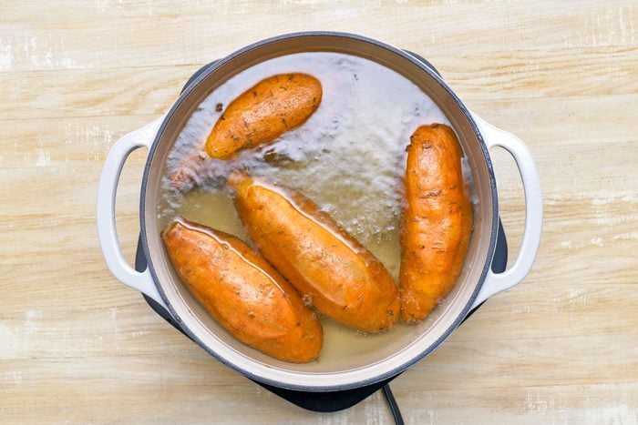 Boiling Sweet Potatoes in Pan of Boiling Water