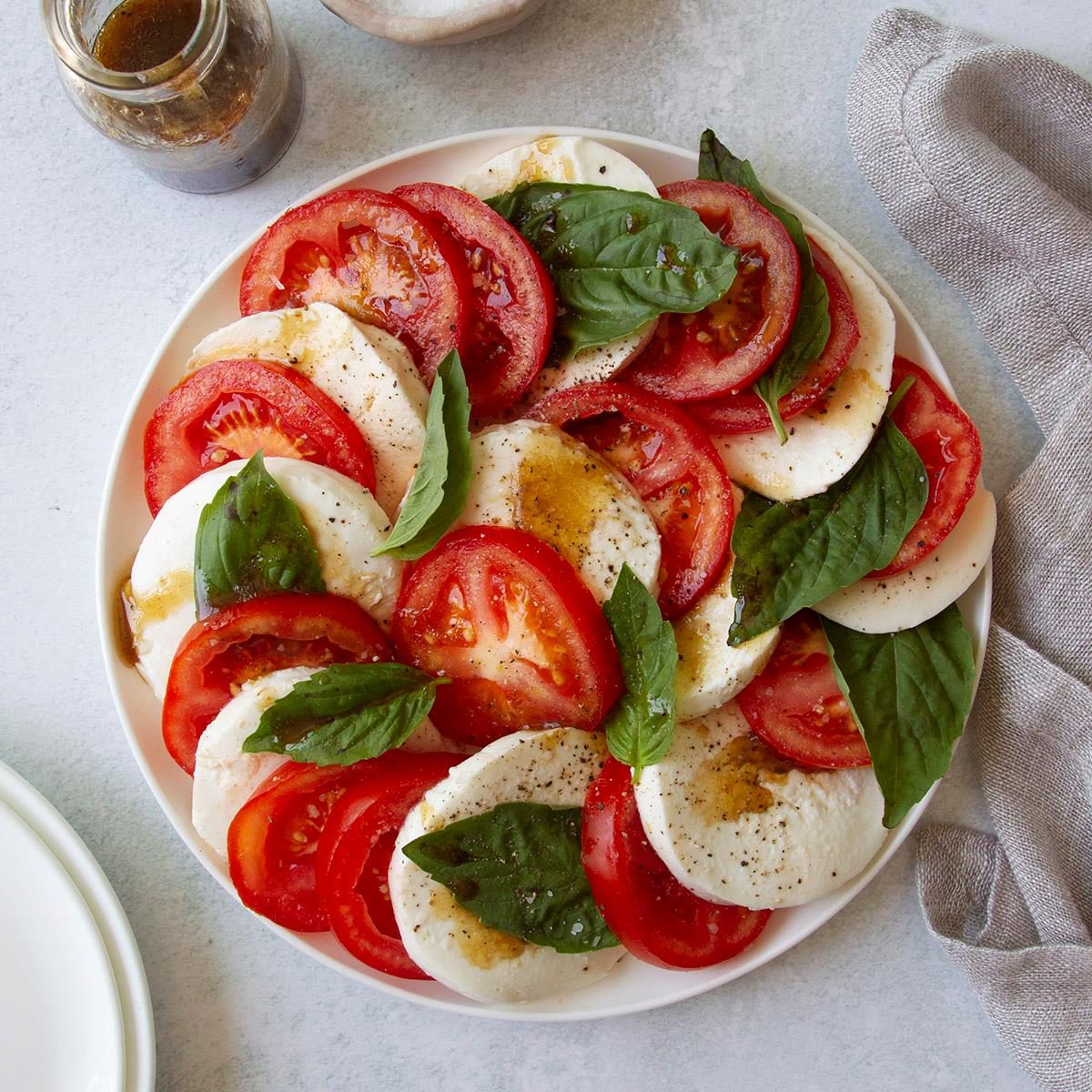 Caprese salad with fresh basil and tomatoes