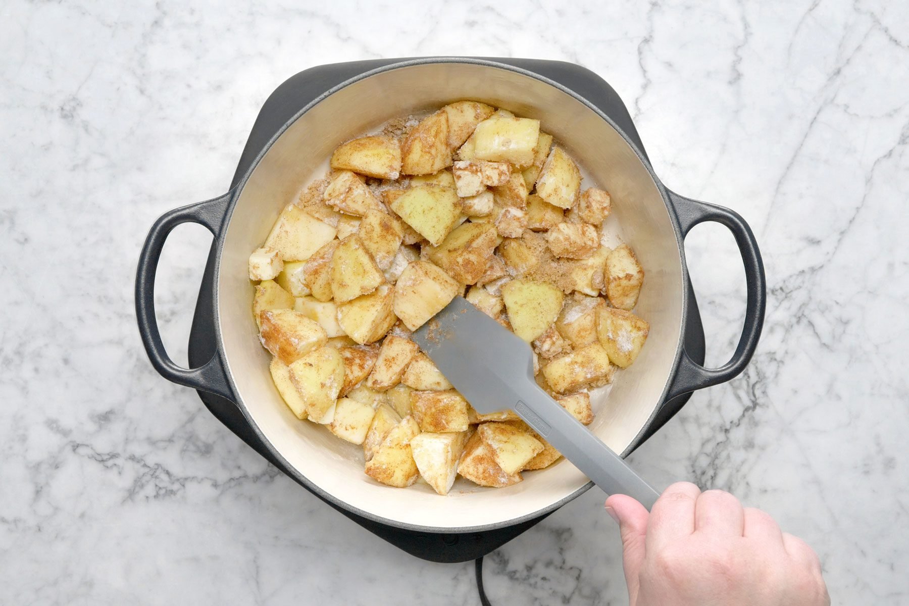 Chunks of apple in a large pot