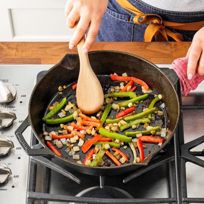Sauteing Peppers and Onions in a Large Cast-Iron Skillet