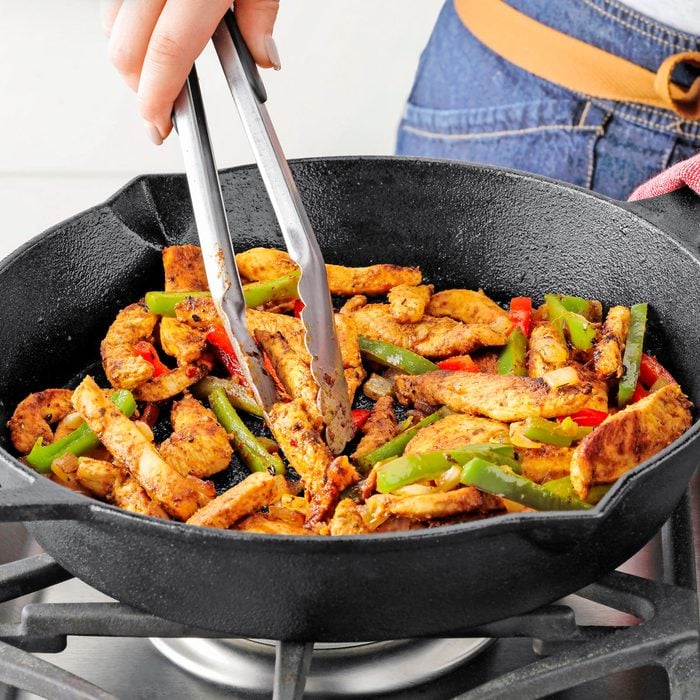 Sauteing Chicken, Peppers and Onions in a Large Cast-Iron Skillet