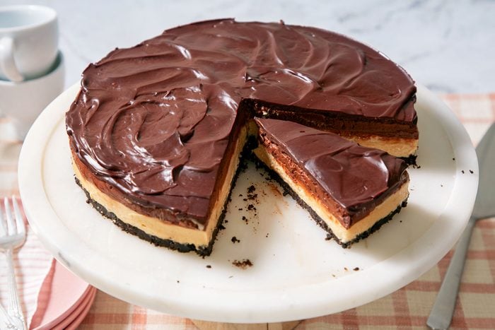 Sliced Chocolate & Peanut Butter Mousse Cheesecake on a Cake Stand