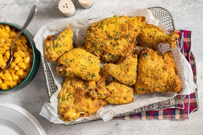 Cornmeal Fried Chicken on Wire Mesh Basket on Marble Surface