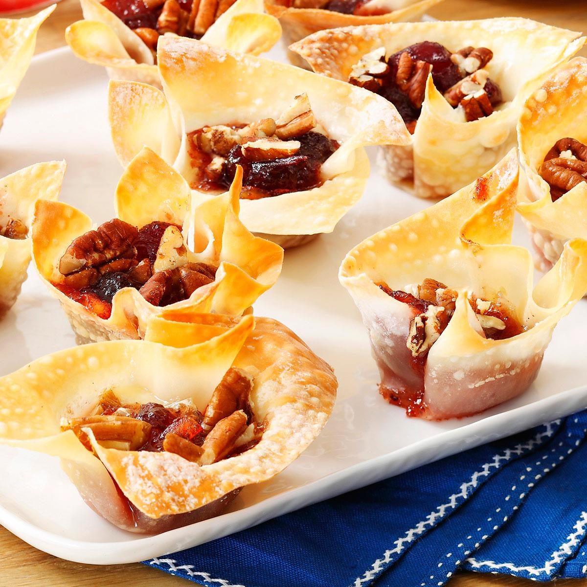 https://www.tasteofhome.com/wp-content/uploads/2018/01/Cranberry-Pecan-Brie-Cups_exps141090_HC143213C02_28_4bC_RMS.jpg?fit=700%2C1024