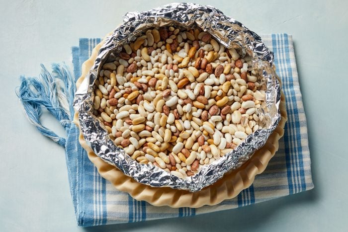 Beans in foil over the pie crust