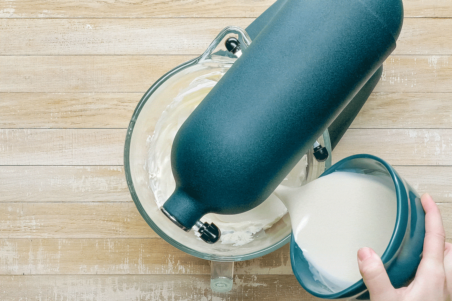 Pouring Cream and Gelatin into Stand Mixer on Wooden Surface