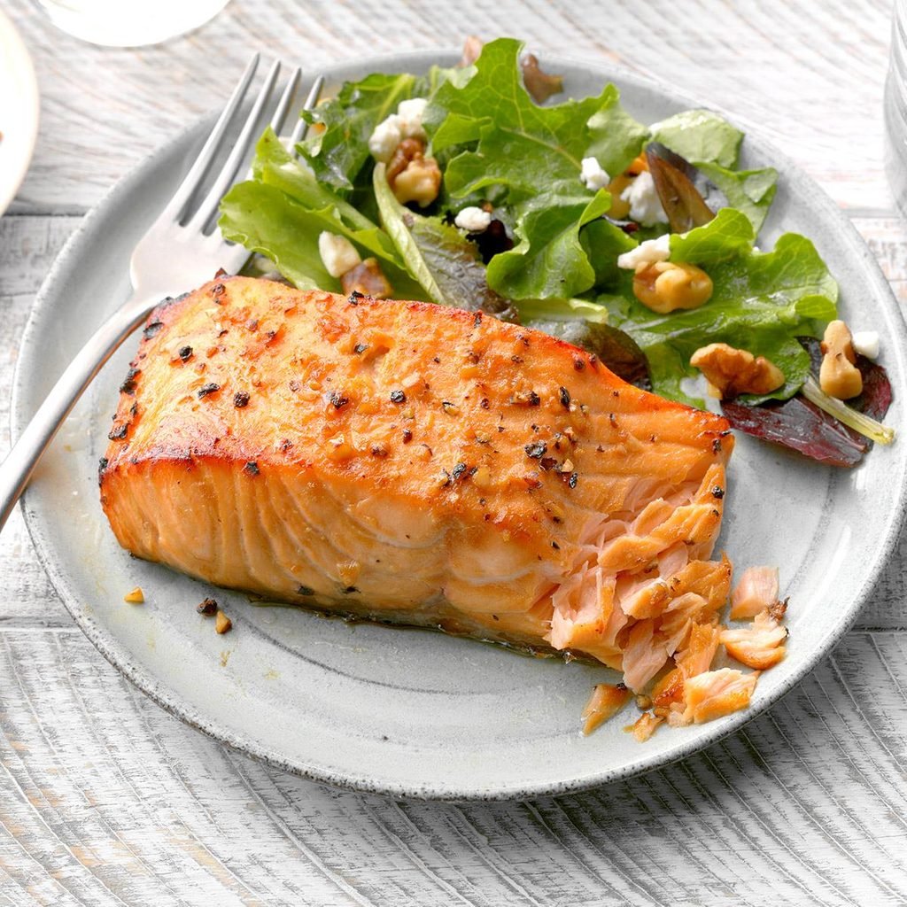 Top 102+ Images a food worker is cooking a whole salmon fillet Latest