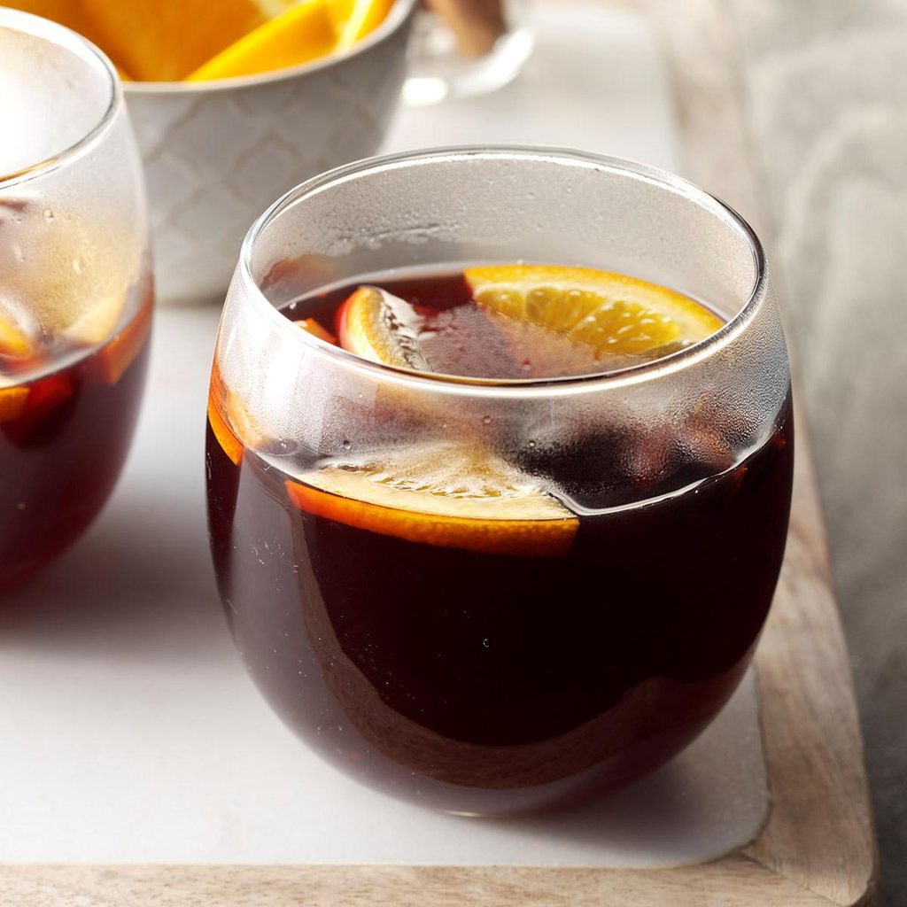mulled wine in a glass topped with oranges