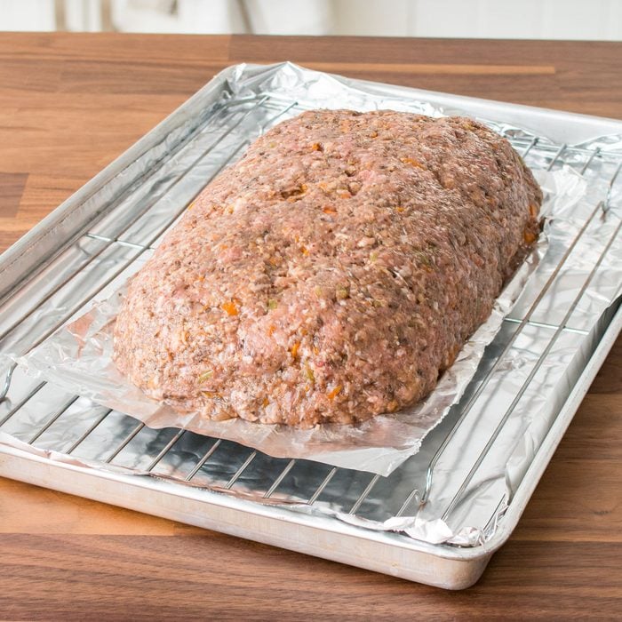 Mushroom Meat Loaf on a Foil on a Rack in Oven Tray