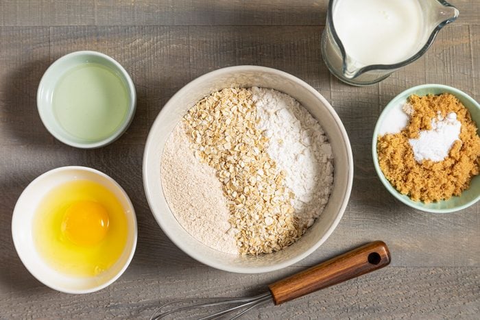 All Ingredients for Oatmeal Pancakes on Wooden Surface